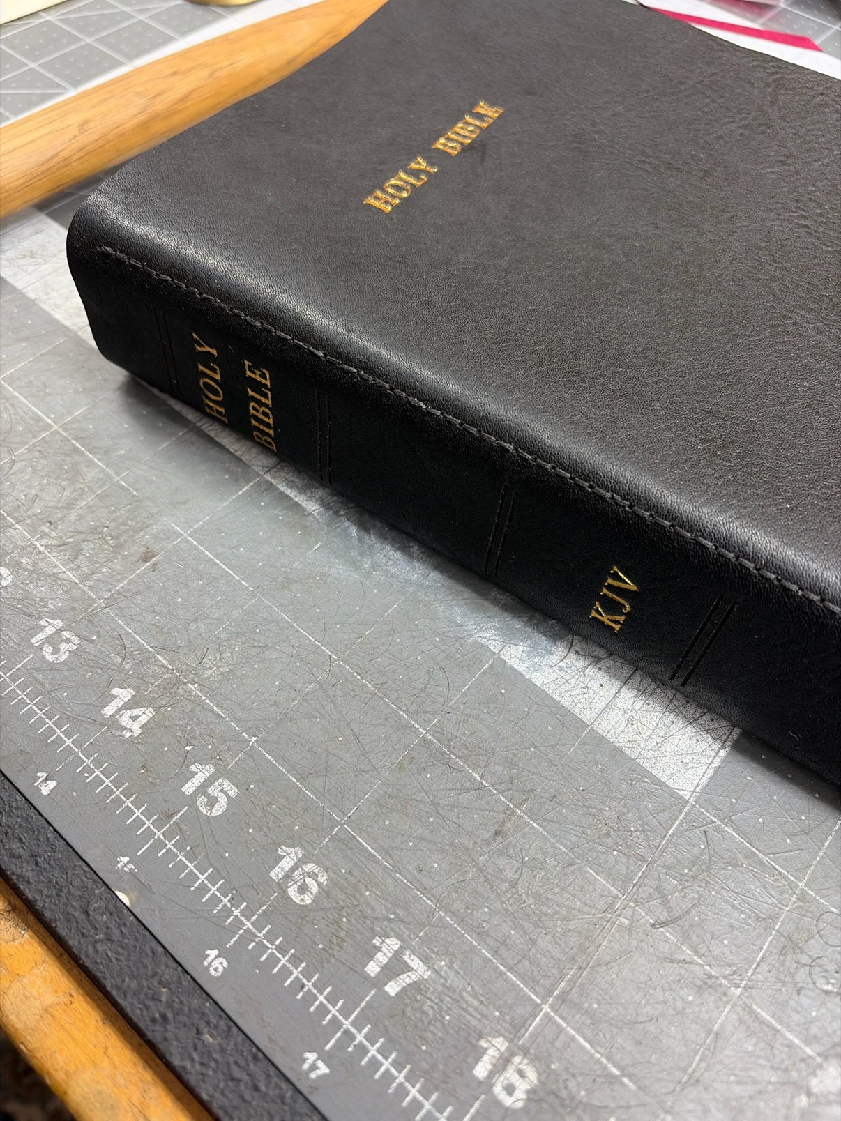 Black leather Bible spine with hand stitching
