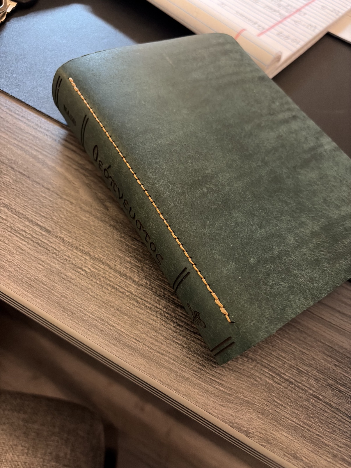 Green leather Bible with contrasting tan stitching
