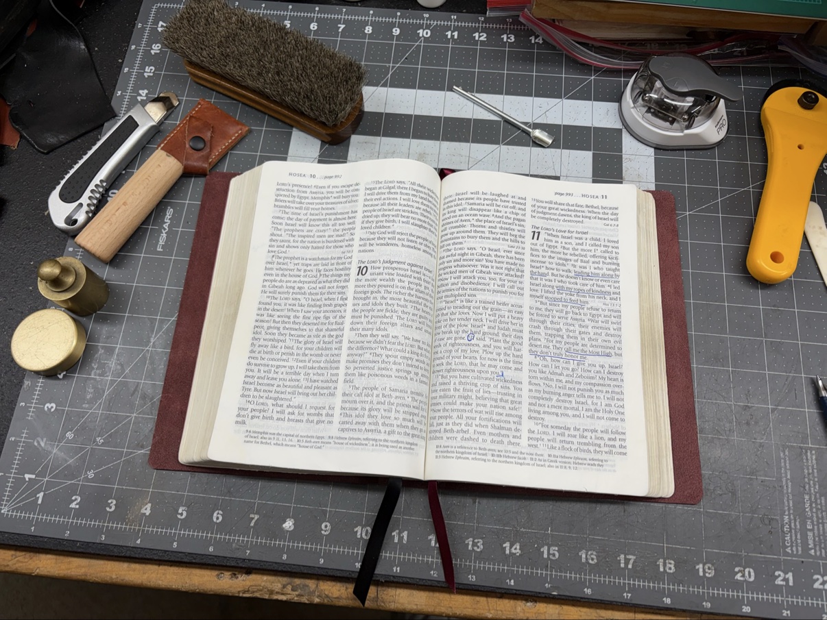Bible open on a burgundy leather cover